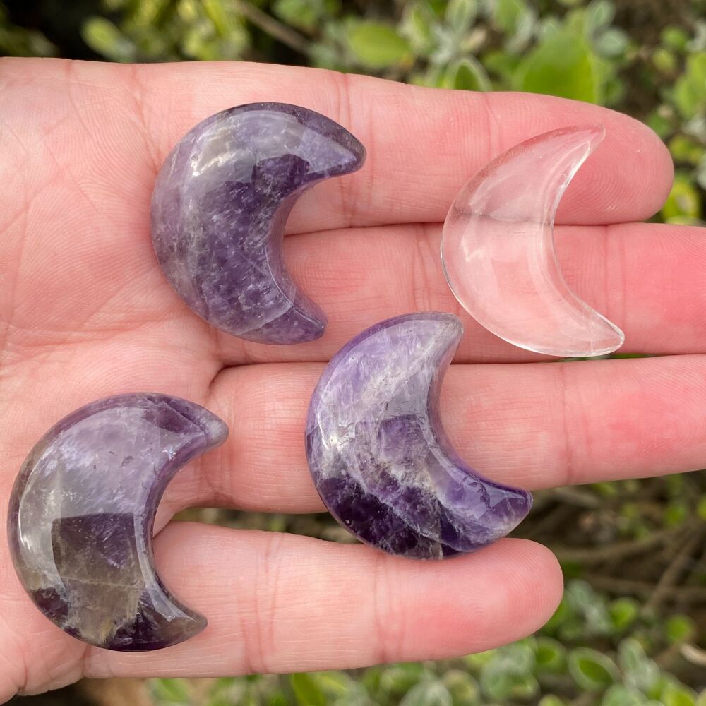 A Set of Four Carved Crystal Moons ~ Quartz and Amethyst