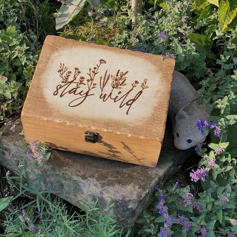 A lovely wooden storage box with "Stay Wild" on the lid