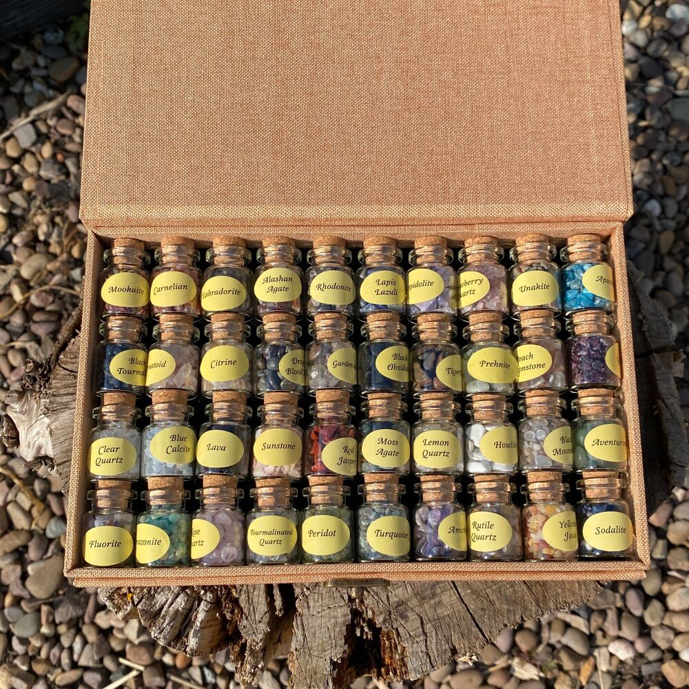 A Collection of 40 Little Bottles of Gemstone Chips