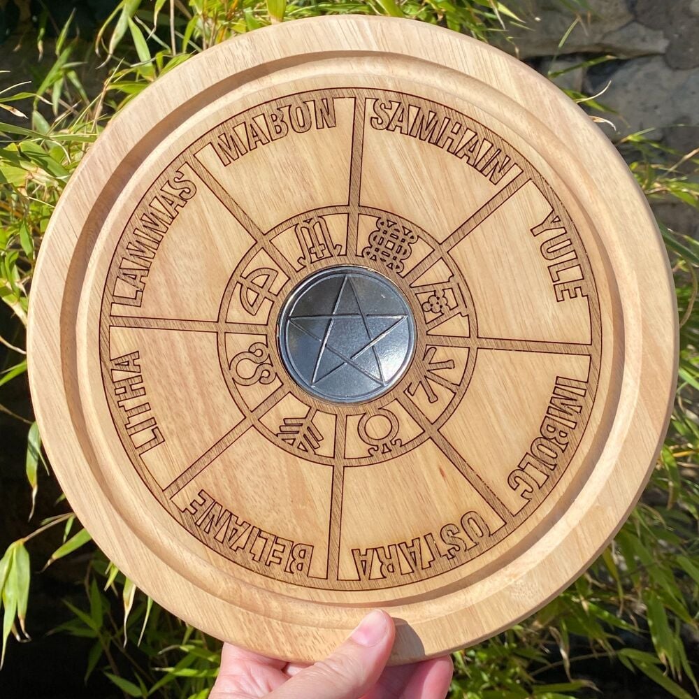 A Handcrafted Spell Plate with Wheel of the Year design and a Pewter Pentag
