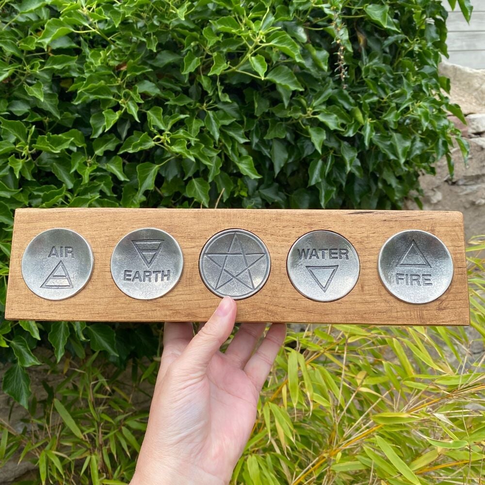 A Stunning Set of Pewter Offering Bowls set into Oak