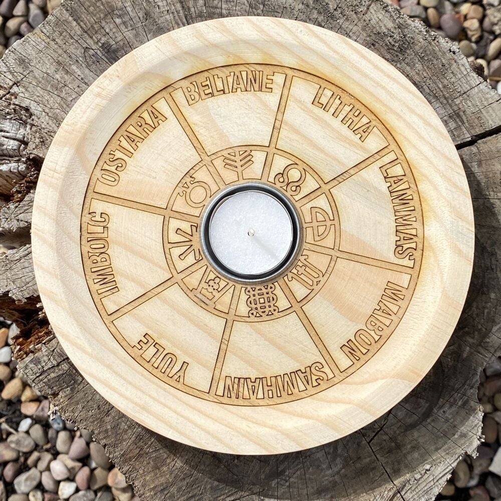 A Rustic Hand Crafted Wooden Spell Casting Plate with Wheel of the Year and T light holder