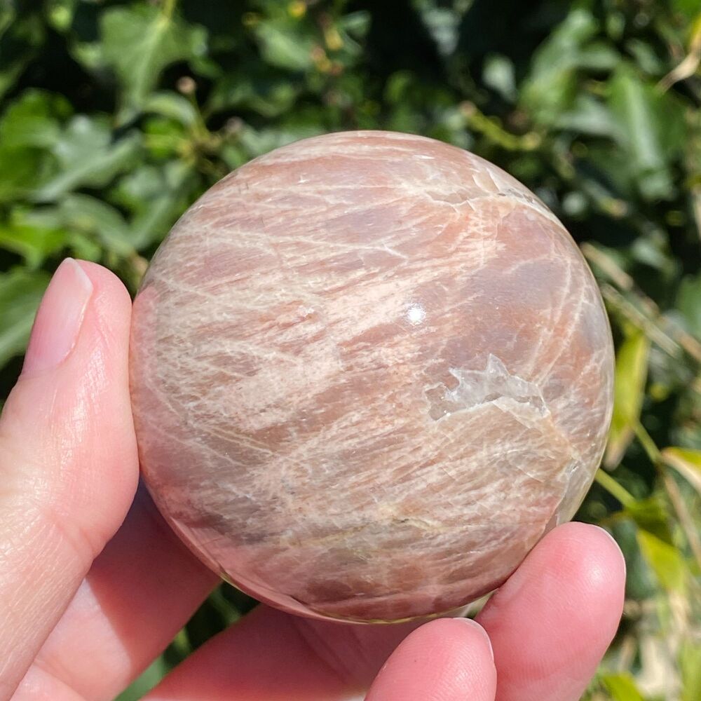 Moonstone Sphere with Lightening inclusions and free stand