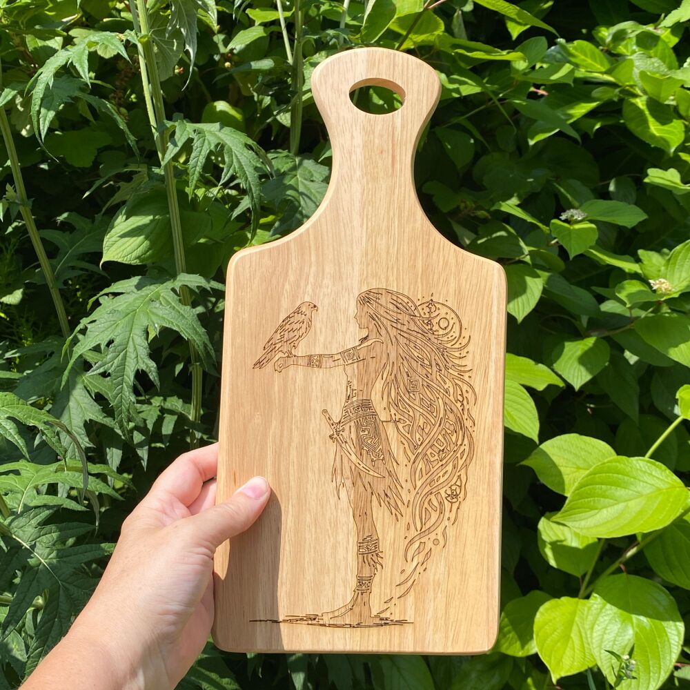 A Handcrafted Wooden Paddle Board with Celtic Shield Maiden design