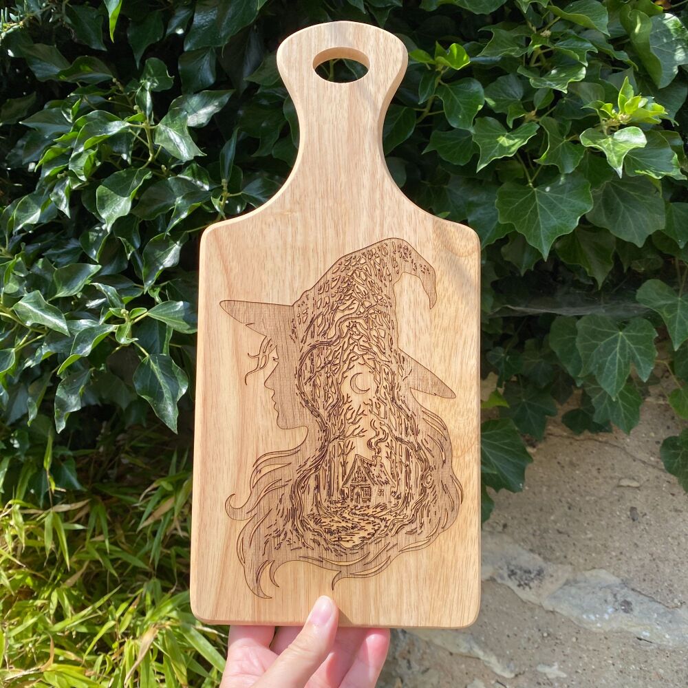 A Handcrafted Wooden Paddle Board with Witches Cottage design