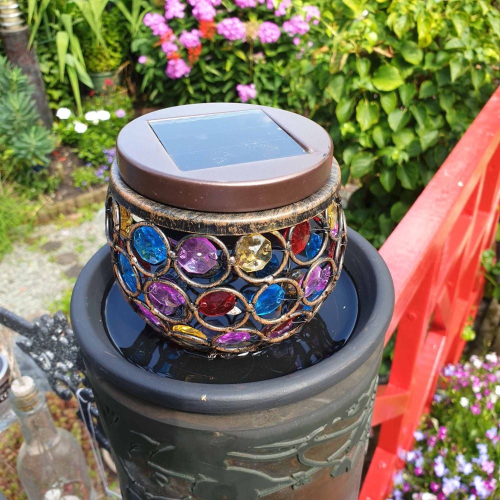 GARDEN LIGHT ON TOP OF A TERACOTTA POT TRAY