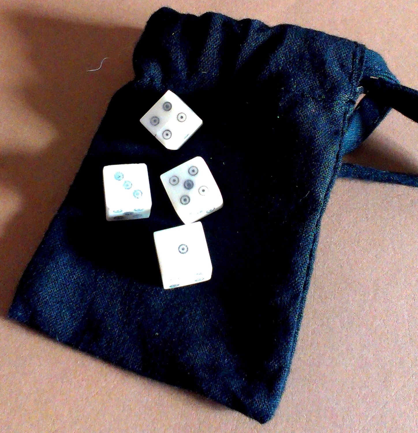 Later historic games set - four ring-and-dot bone dice