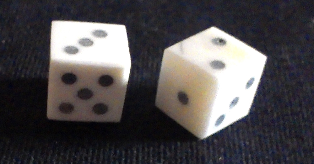 Two solid-pip style bone dice from The Historic Games Shop