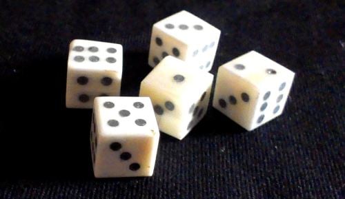 Five solid-pip style bone dice from The Historic Games Shop