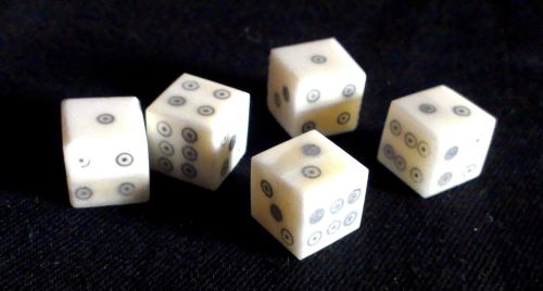 Five ring-and-dot style bone dice from The Historic Games Shop