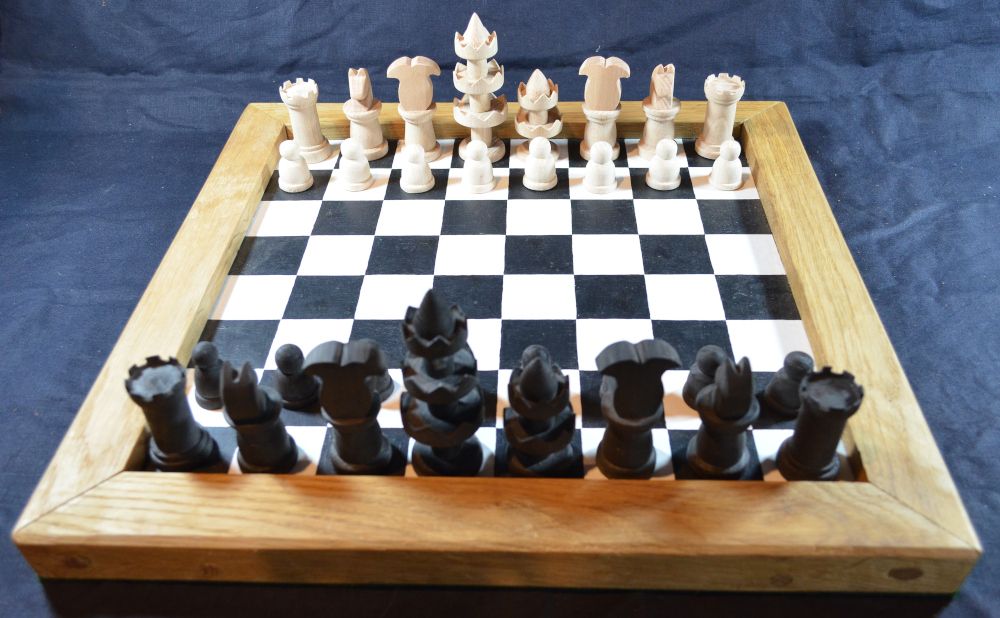 Reconstruction of the Selenus chess set, shown on our painted chess board
