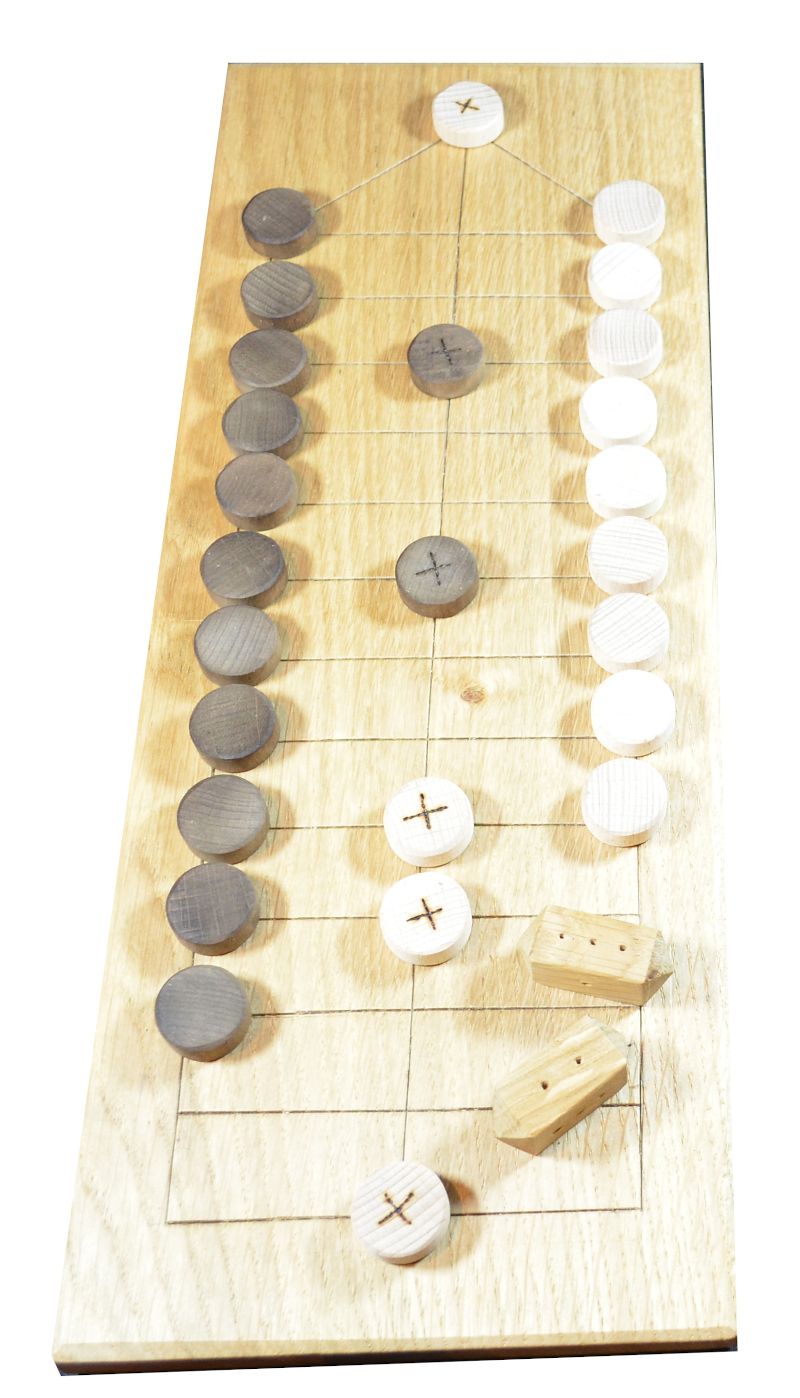 Oak game board showing two-sided playing pieces and two four-sided dice