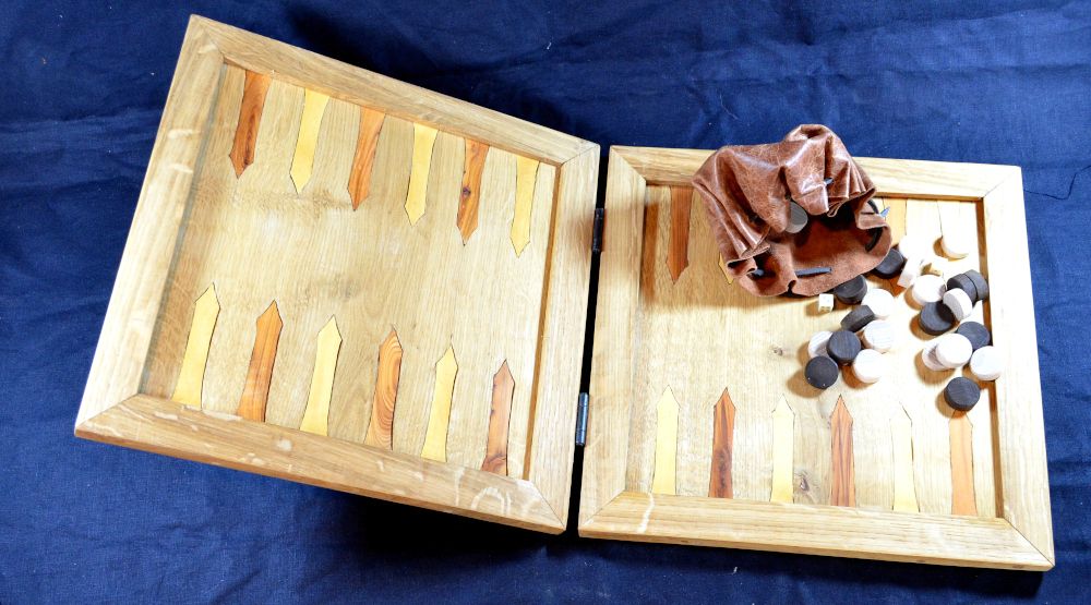 Reproduction oak backgammon board, with inlayed box and yew points; with beech wood counters and bone dice in leather pouch