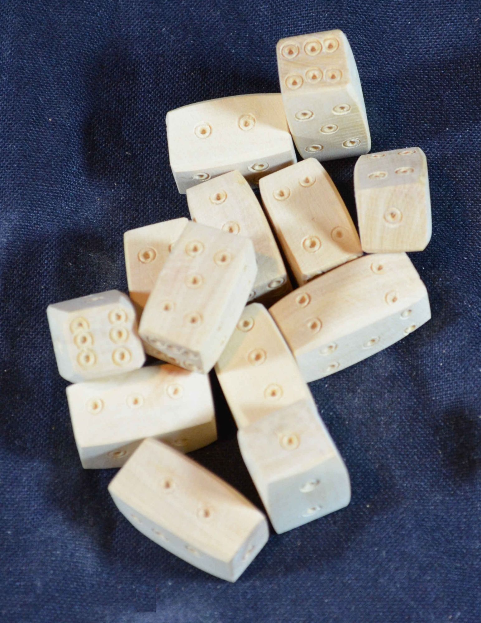 Several reproduction boxwood Viking long dice from The Historic Games Shop