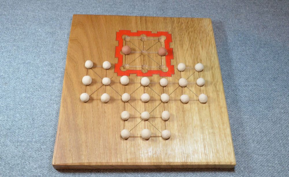 Asalto game, with oak board and fired clay playing pieces