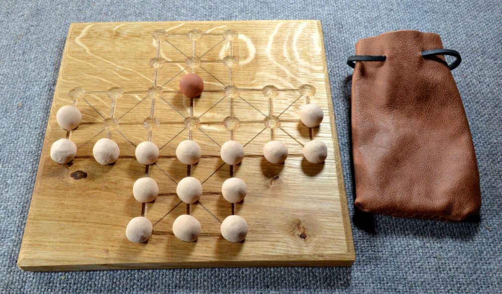 Fox and Geese gameboard in 17th century layout, with ceramic playing pieces
