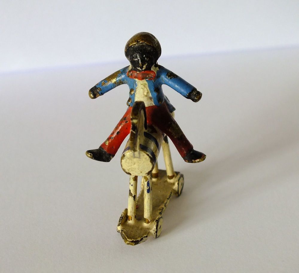 Miniature Golly on Toy Horse Figure -After Florence Upton