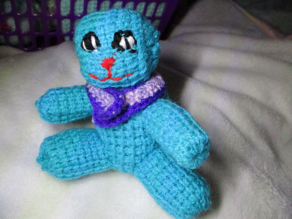 Vivid Cyan Blue Crocheted Kito-Pal with round head and purple shawl