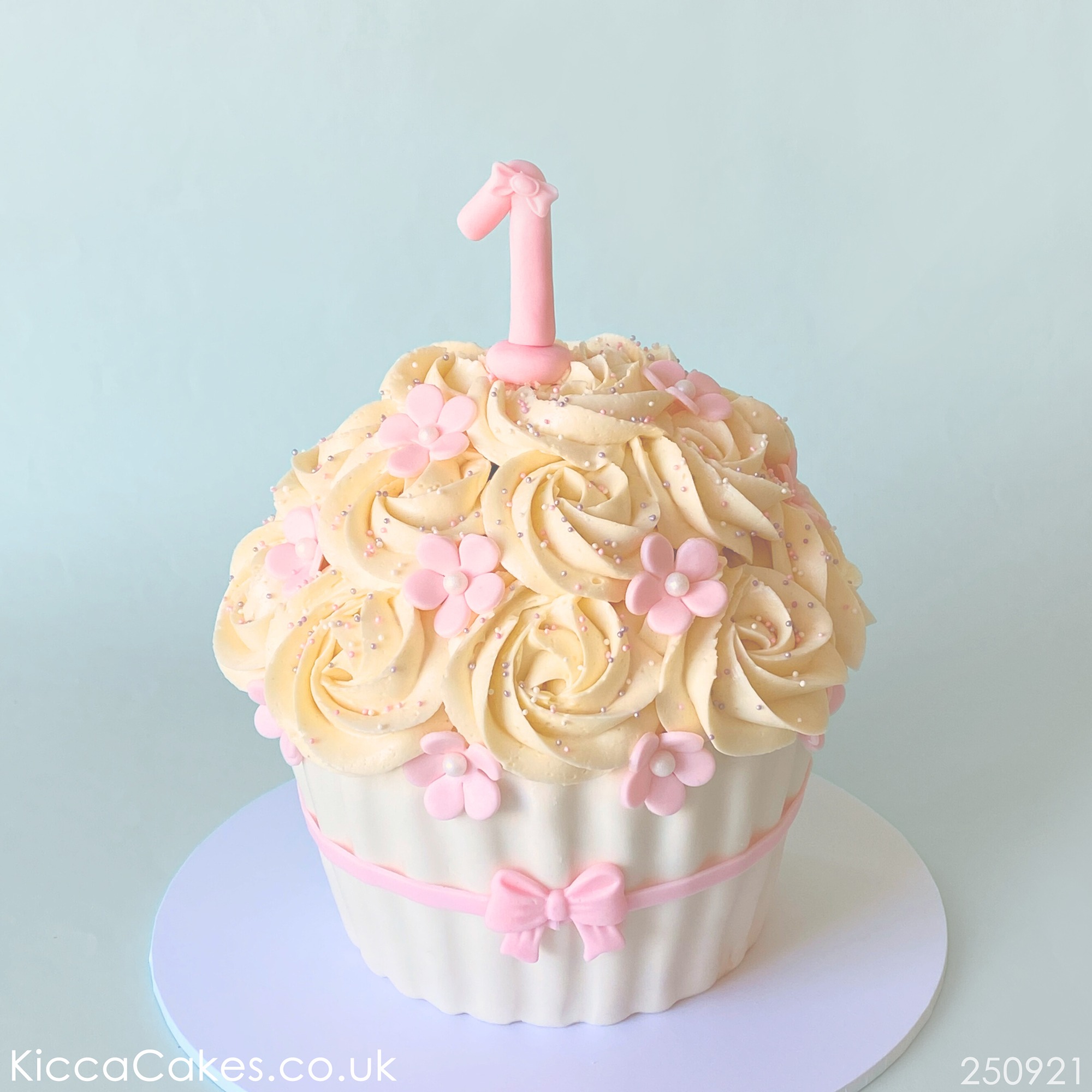 Girl first birthday giant cupcake.