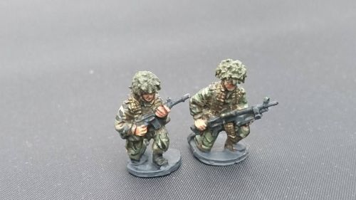 BAOR26 BAOR GPMG patrol crouching armed with GPMG and SLR