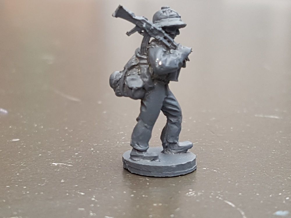 LTD28 Vietnam North Vietnam Army regular with heavy pack and AK47 on should