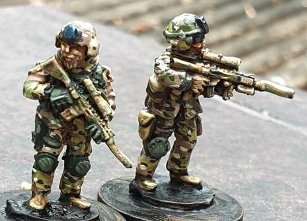 SF22 SF Snipers in plate carriers and SF MICH helmets with DMR