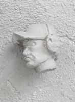 HED96 Swedish baseball cap (strong V shape on peak) with ear defenders.