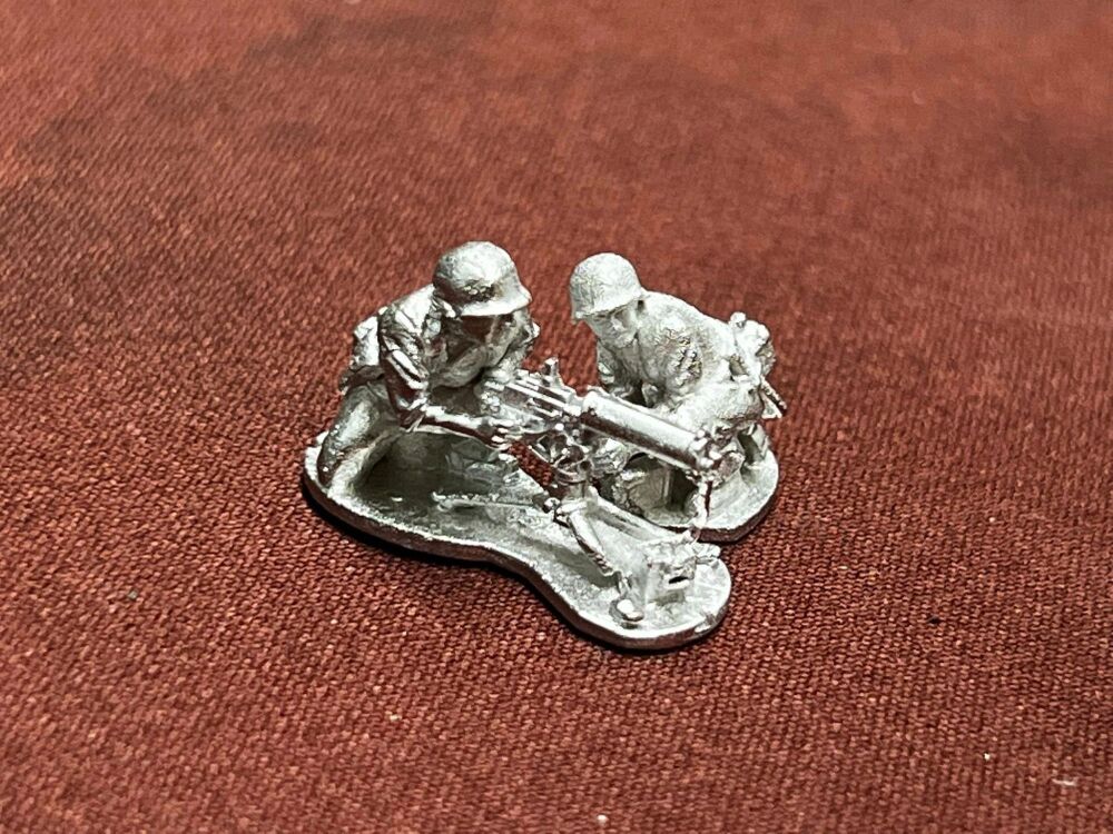 GUA04 US Soldiers M1919 MMG team firing  in hot weather fatigues WW2