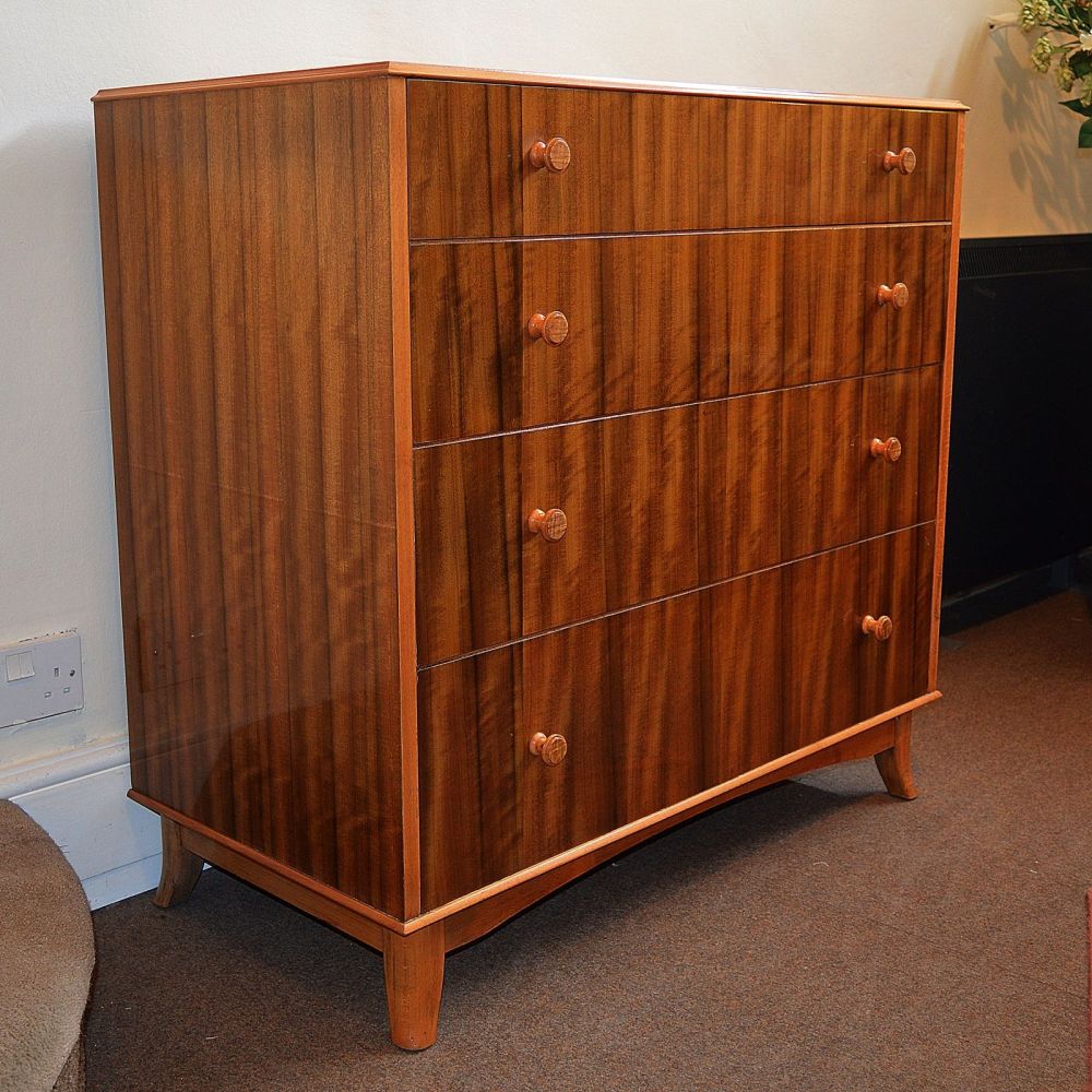 A good mid century walnut chest of drawers.