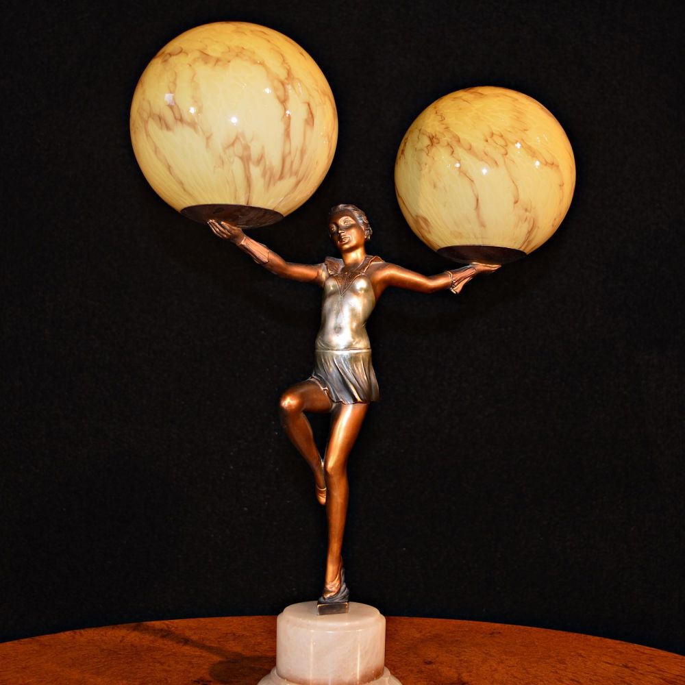 Fabulous Art Deco lamp modelled as a nude holding aloft twin globes