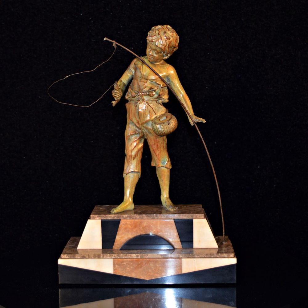 Attractive Art Deco patinated figure of a boy fishing