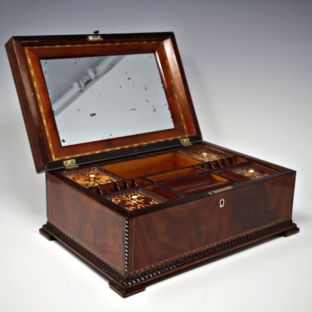 Antique flame mahogany sewing / jewellery box.