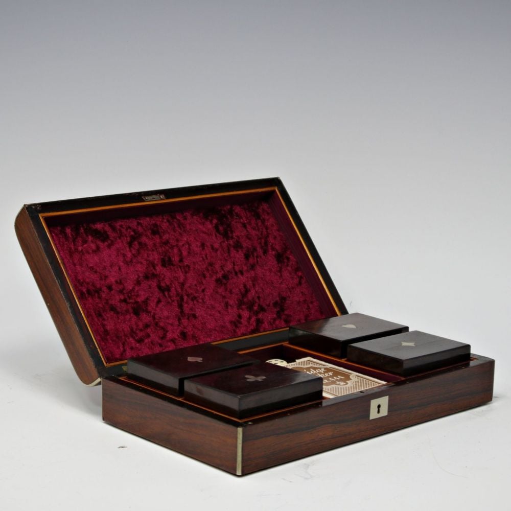 Rosewood and white metal inlaid games box.
