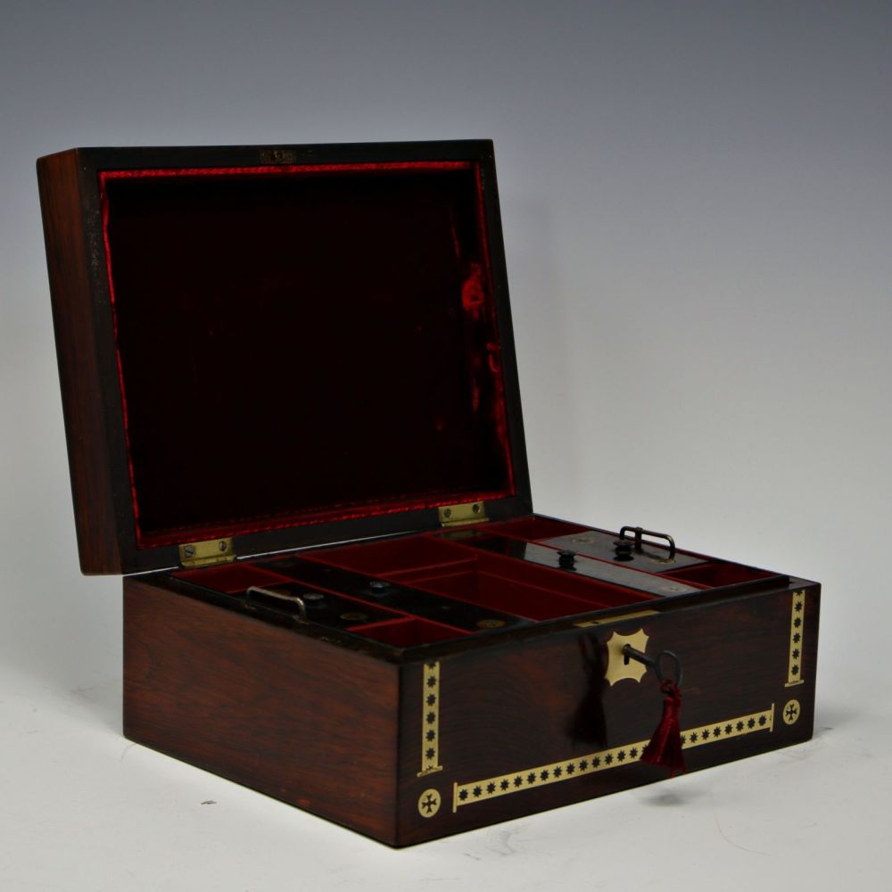 Antique rosewood and brass inlaid jewellery box.