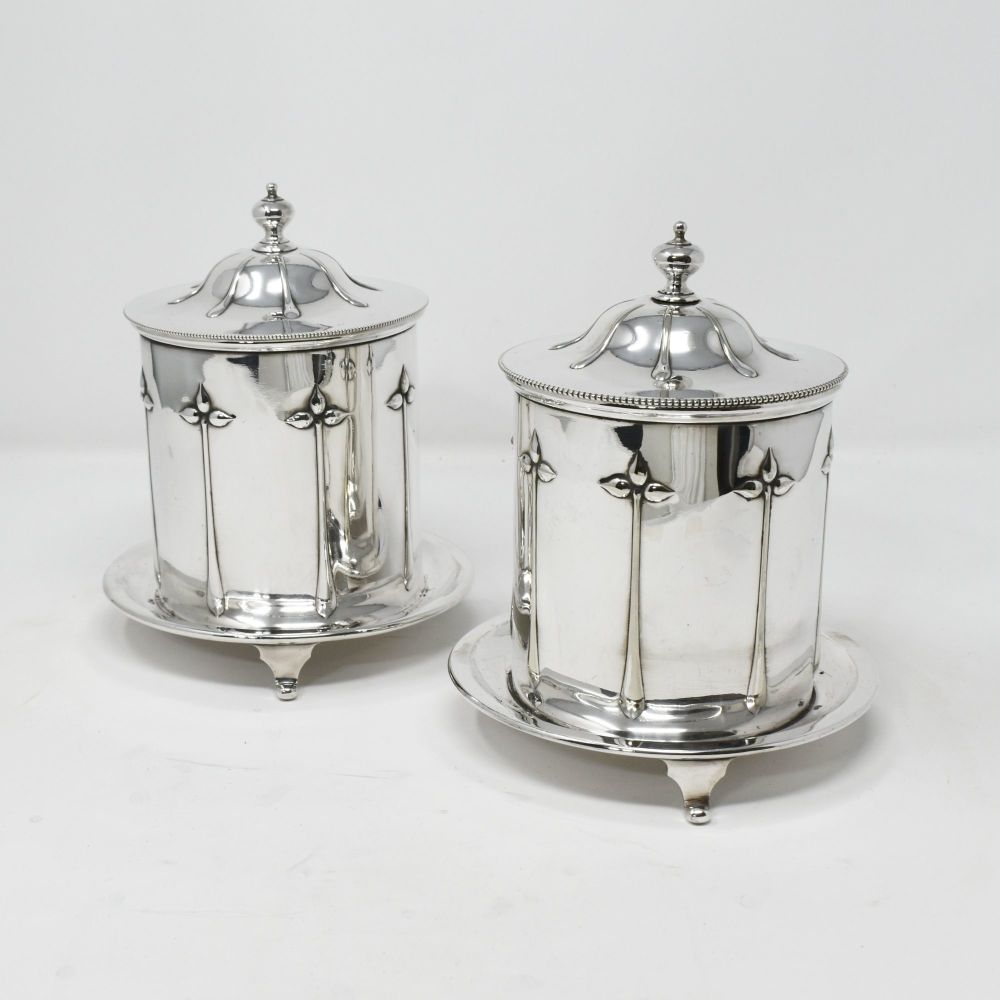 Fine pair of Art Nouveau silver plated biscuit boxes.