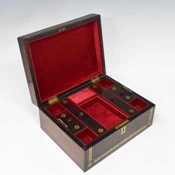 Antique rosewood and brass inlaid jewellery box.