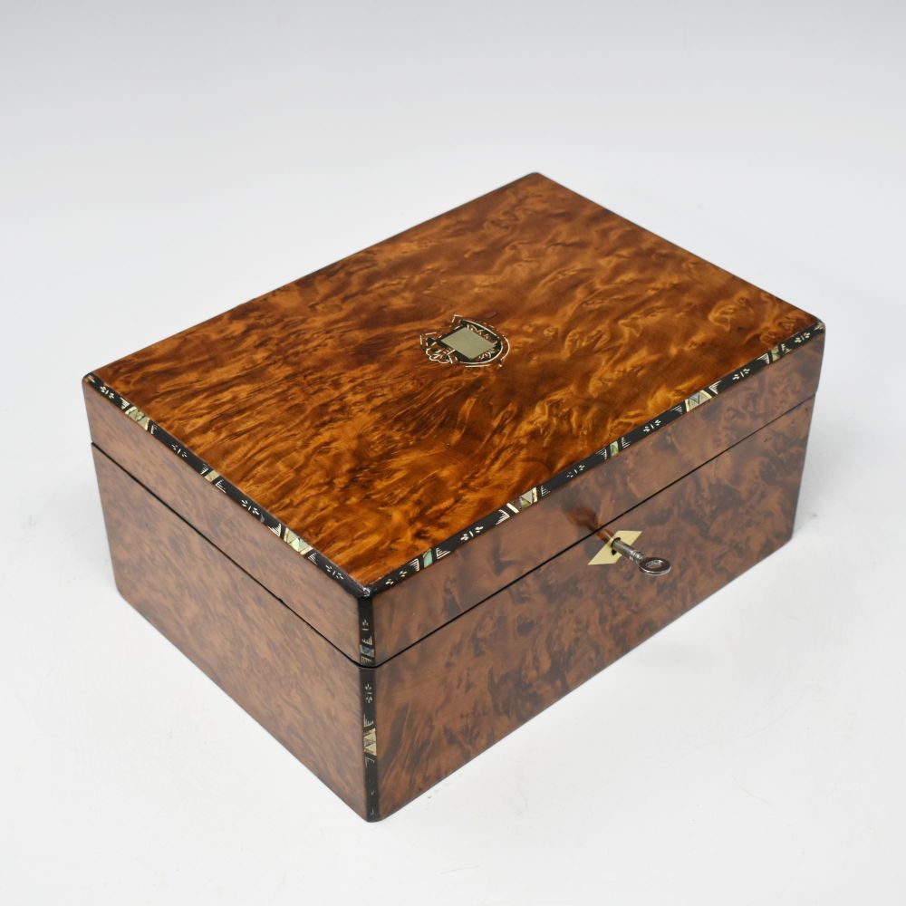 Antique amboyna jewellery box.