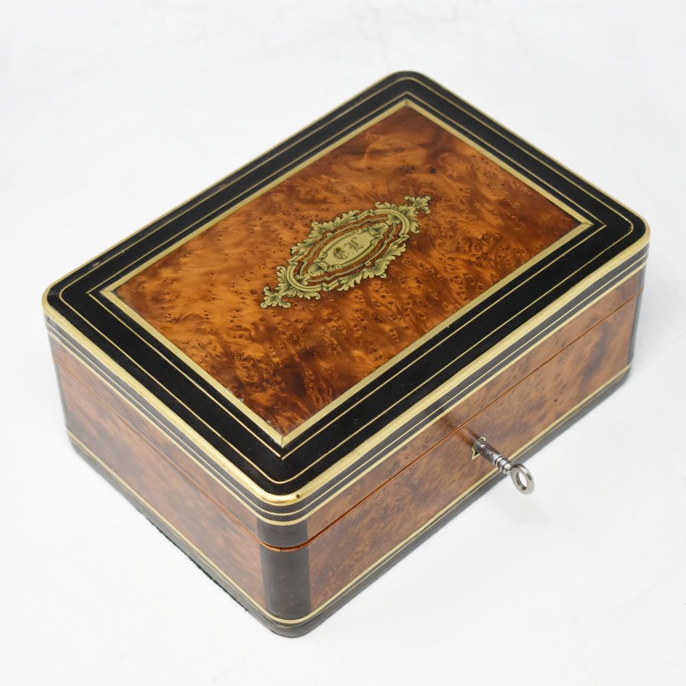 Antique amboyna jewellery box by Tahan, Paris.
