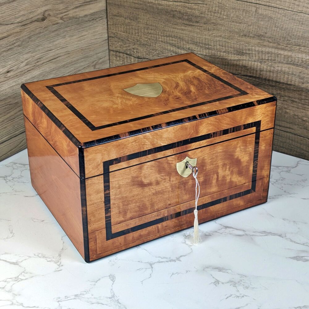 Unusual satinwood & coromandel jewellery box.