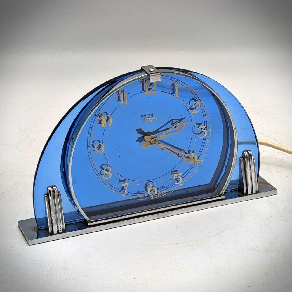 Smiths Art Deco blue glass electric mantel clock.
