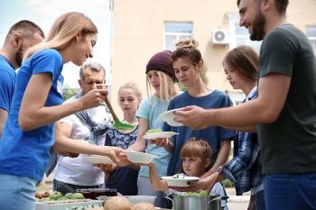 volunteers serving food