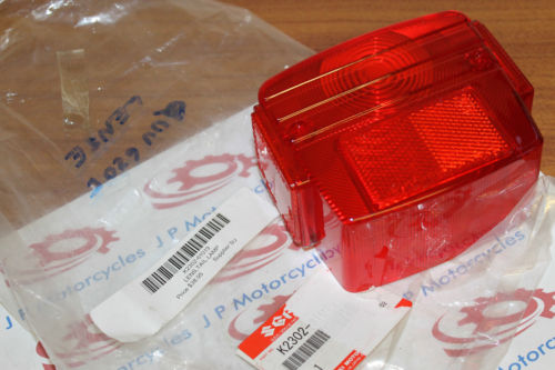 Suzuki QUV620F Rear Light Lens NOS OEM p/n K2302-61019