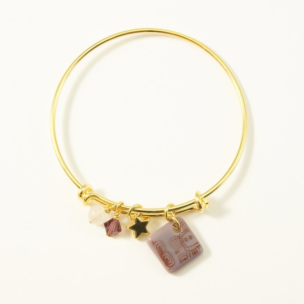 Purple neo bangle on gold