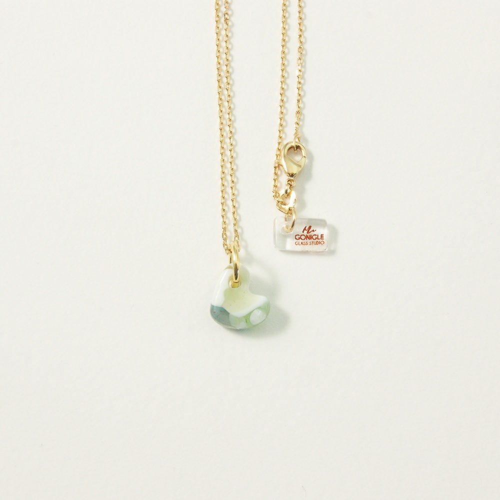 Pastel glass heart on gold