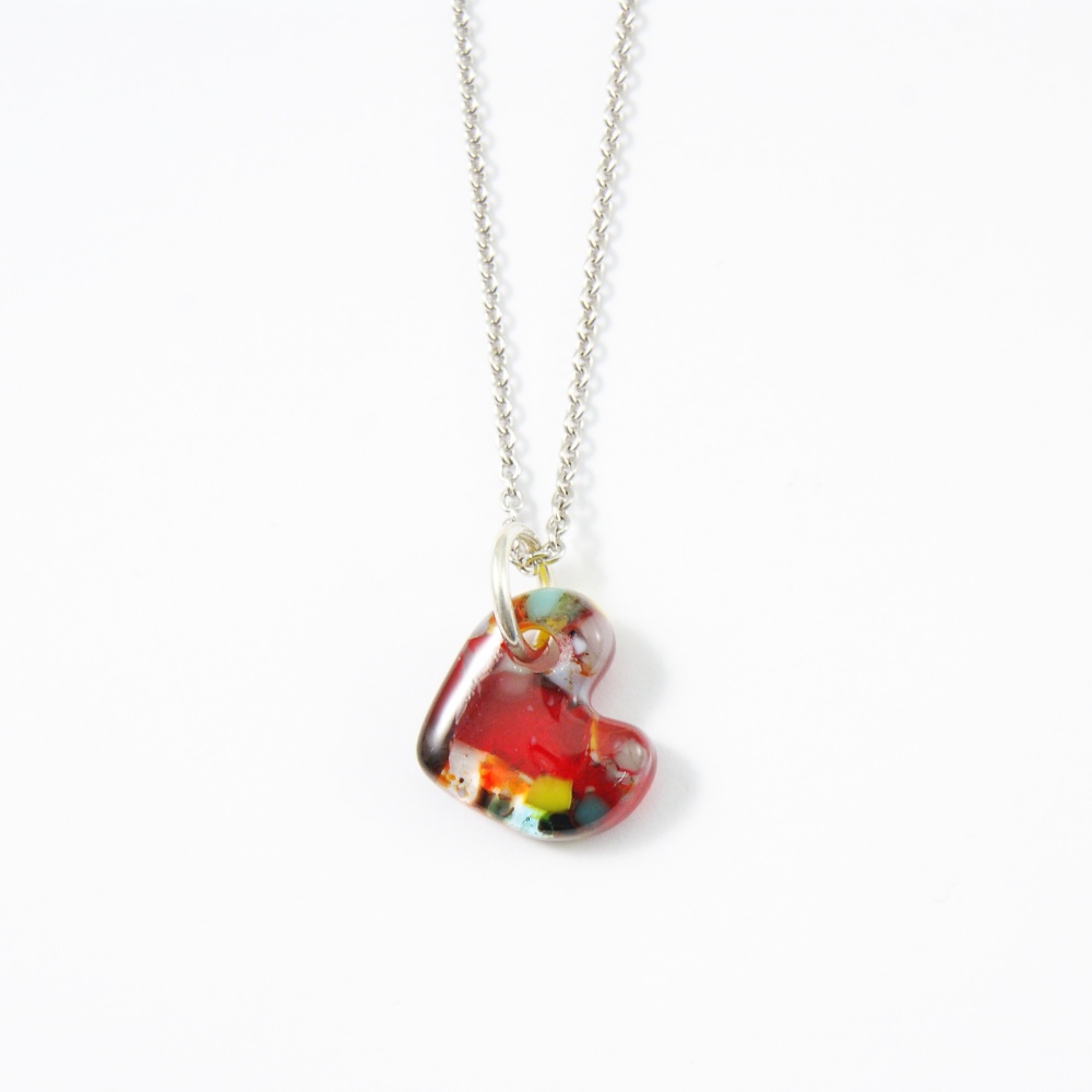 Red sweetheart, A Hand carved glass Heart on silver.