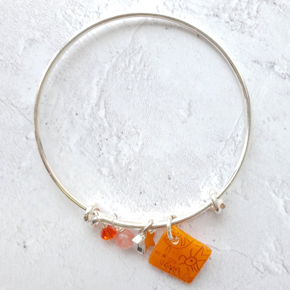 Orange neo bangle on silver