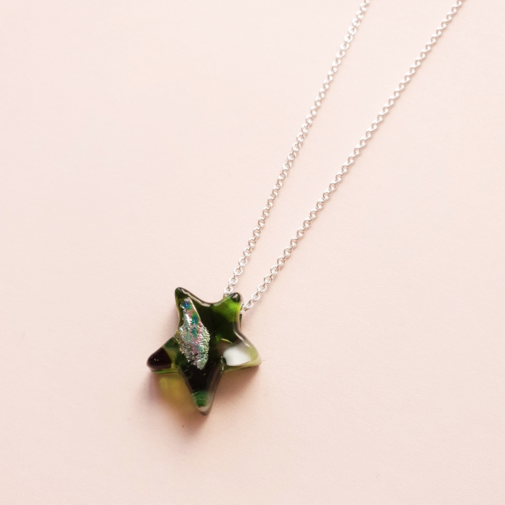Silver shooting star in greens