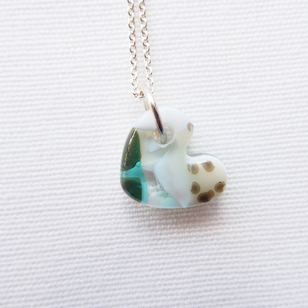 Nebula, A Hand carved glass Heart in pastel colours on silver.