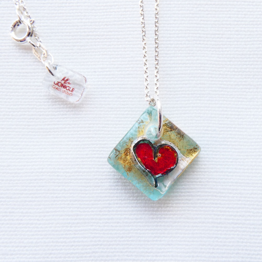 Small fused heart in Turquoise on an 18 inch solid sterling silver chain.