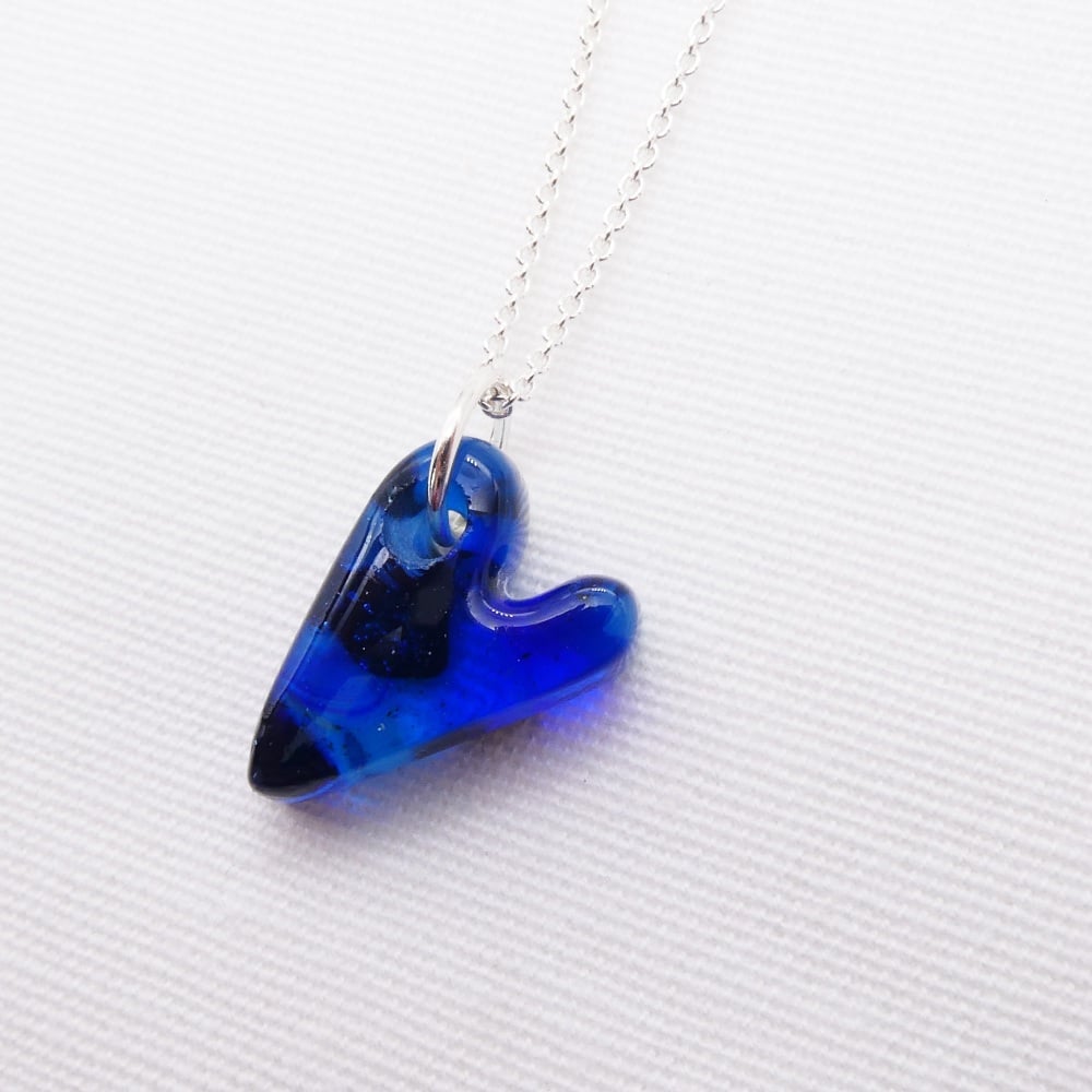 Blue glass heart on silver